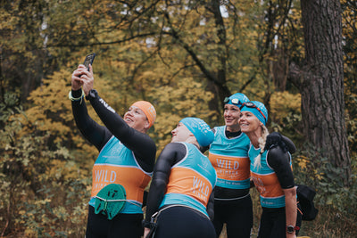 Four Swimrun women posing together for a selfie